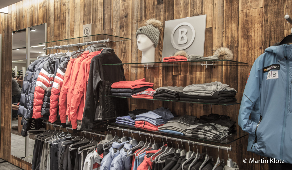 Wall with ski clothing in the shop